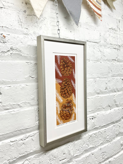 Pinecone Buddies FRAMED - reduction woodblock print (7.5x13")