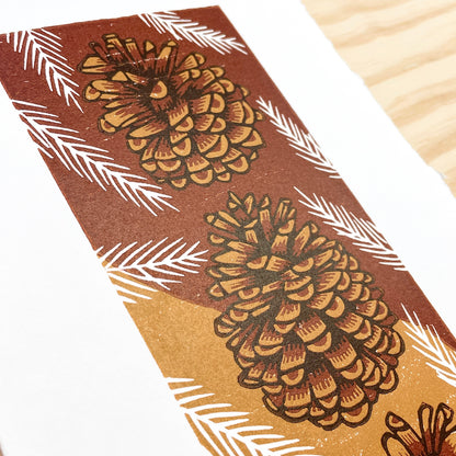 Pinecone Buddies FRAMED - reduction woodblock print (7.5x13")